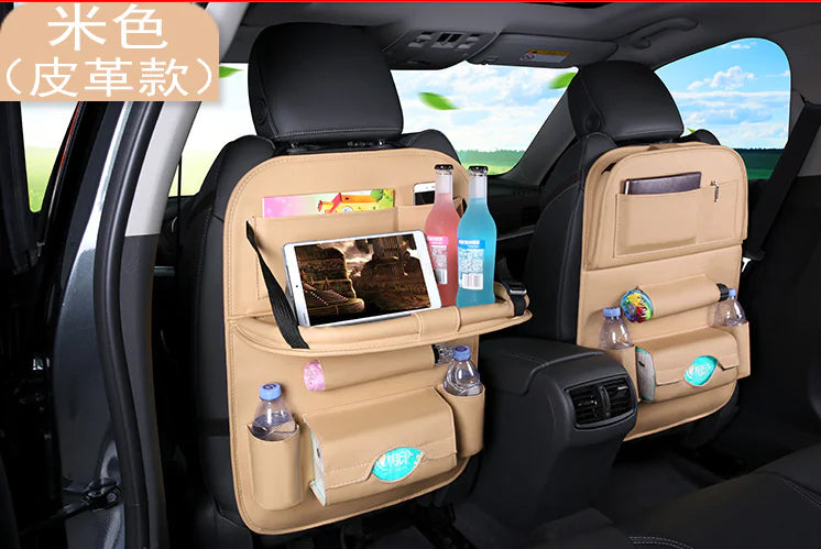 Car back seat organizer with multiple compartments and a tablet stand, placed inside a vehicle.