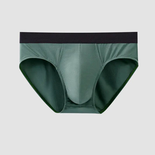 Green men's underwear with black waistband on a light gray background