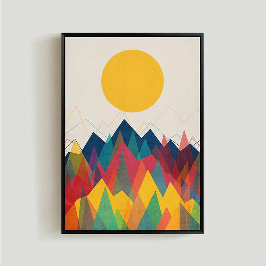 Framed artwork with a colorful mountain landscape and yellow sun on a light gray background