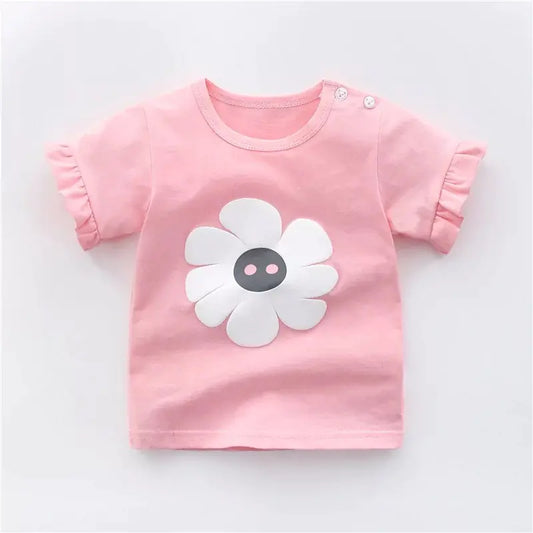 Pink children's t-shirt with a white flower design on a light gray background