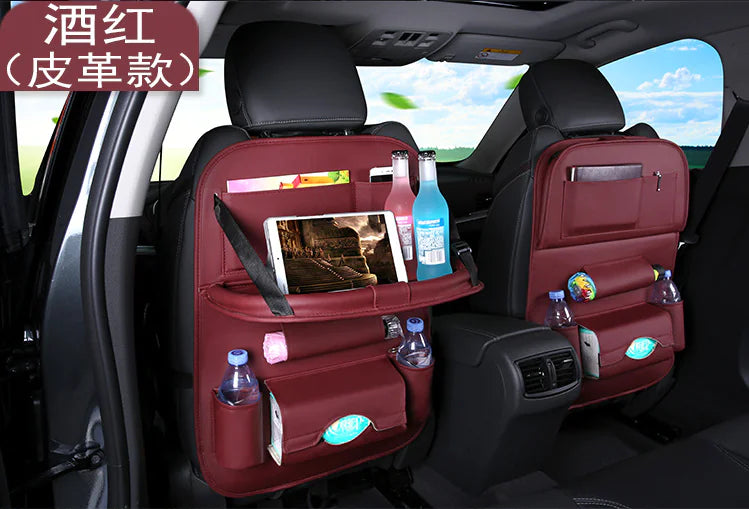 Car back seat organizer with multiple pockets and items in a vehicle