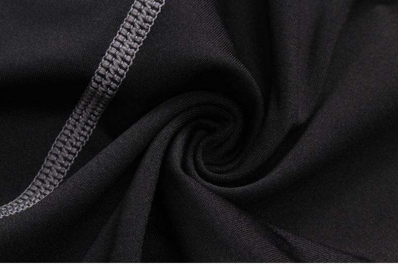 Close-up of black fabric with a zipper detail