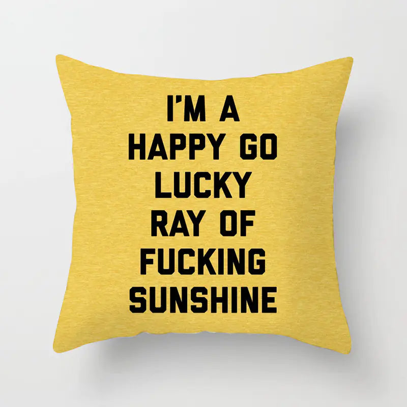 Yellow pillow with black text on a white background