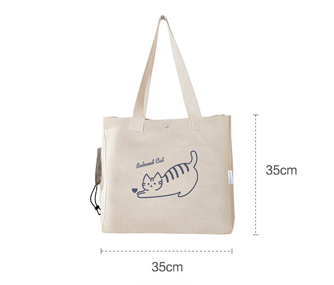 Beige tote bag with a cat design and measurements on a white background