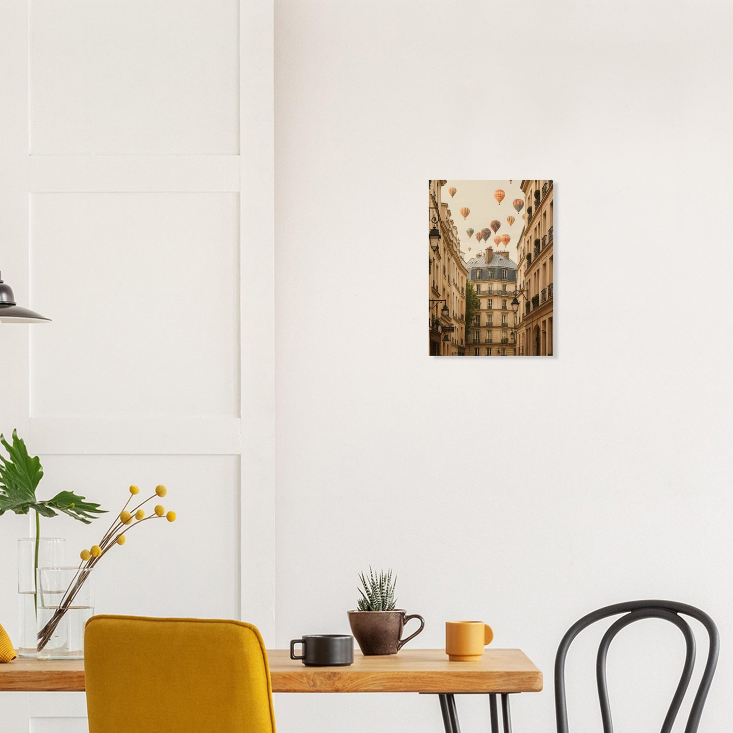 Dining area with a wooden table, chairs, and a wall art of hot air balloons over a city.