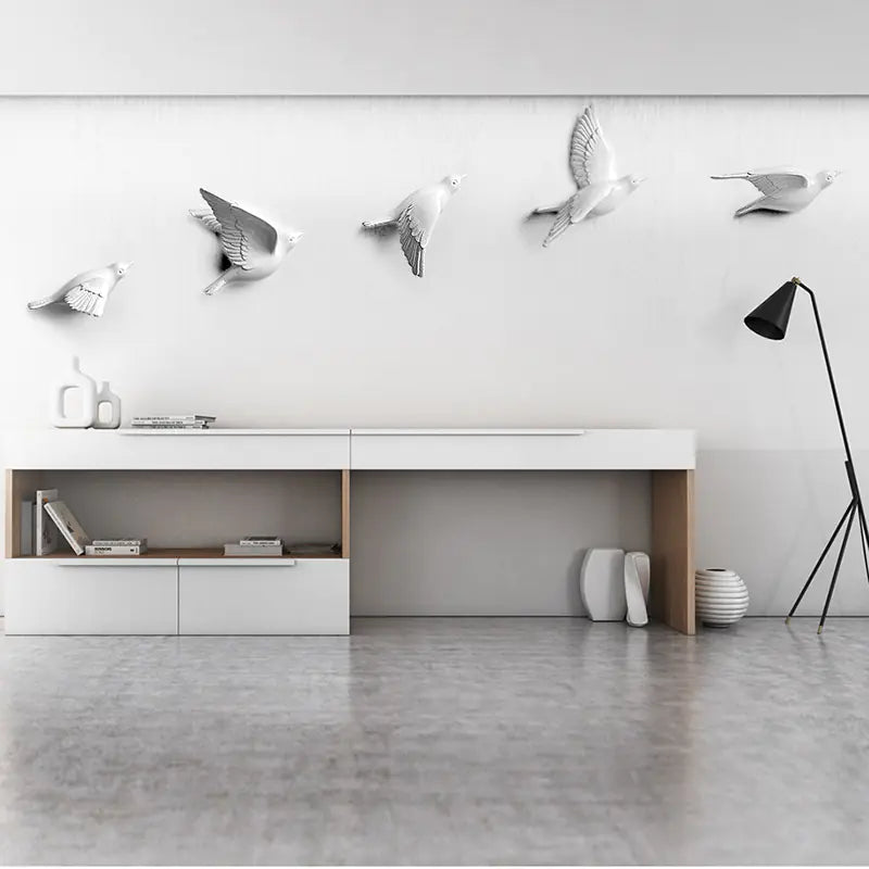 Modern interior with decorative wall lights shaped like birds in a minimalistic room.