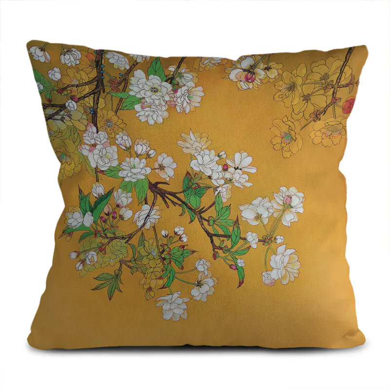 Decorative pillow with floral design on a yellow background
