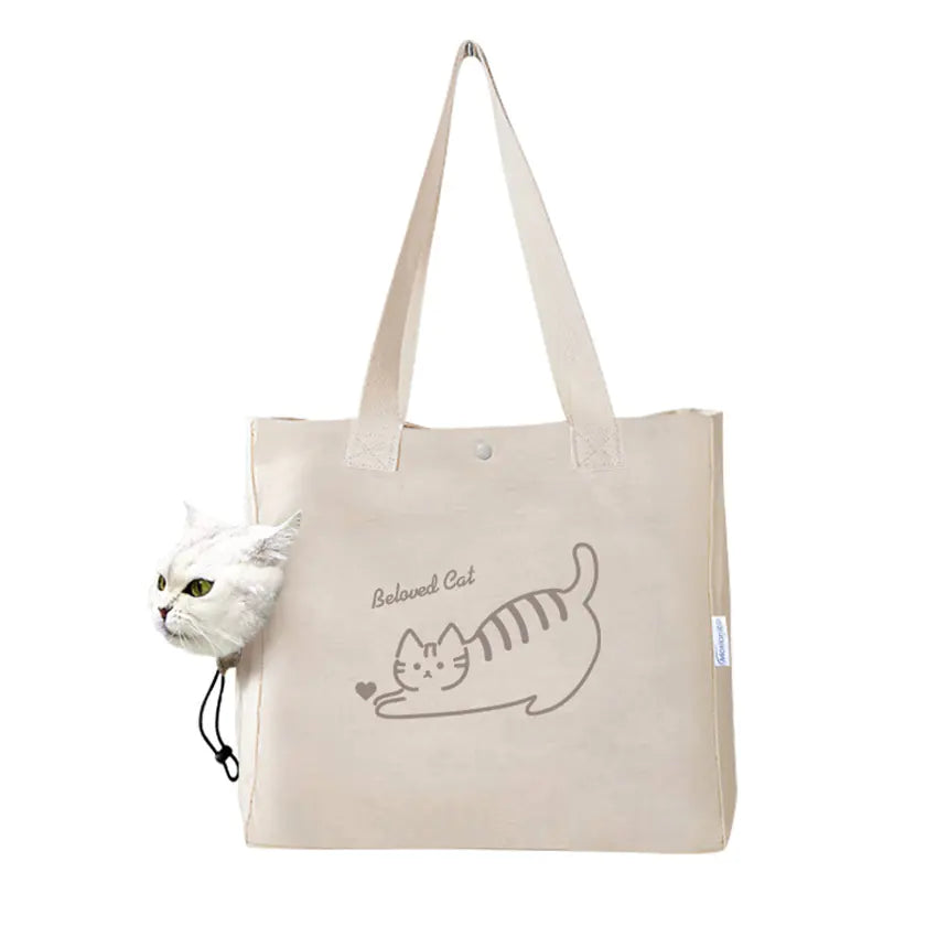 Beige tote bag with cat design and text on a white background
