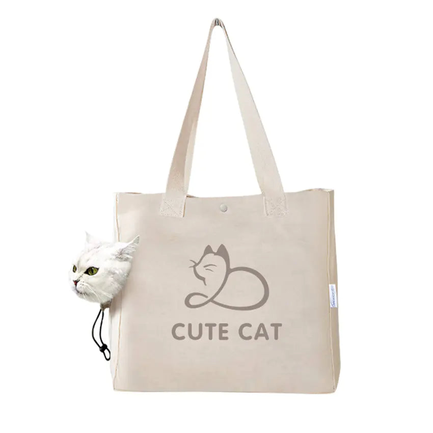 Beige tote bag with 'Cute Cat' text and a cat illustration, accompanied by a small plush cat toy.