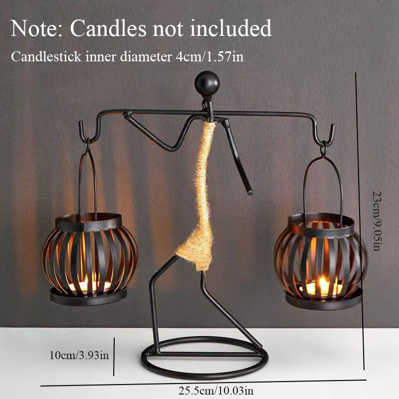 Decorative candle holder with two candle holders and a central candle on a gray background