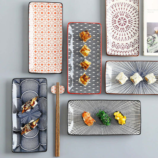 Colorful Nordic Japanese underglaze ceramic plates with sushi and snacks, enhancing modern dining aesthetics.