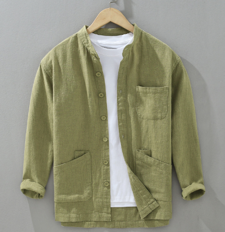 Green jacket on a hanger against a gray background