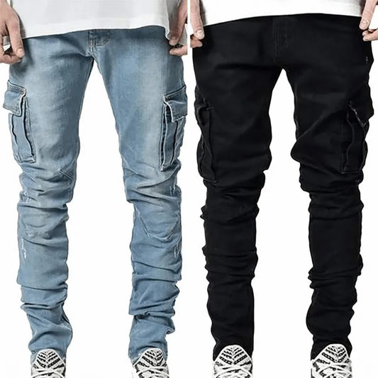 Two pairs of cargo pants, one blue and one black, held up against a white background.