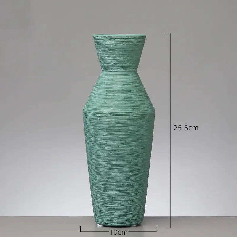 Green textured vase with dimensions on a gray background