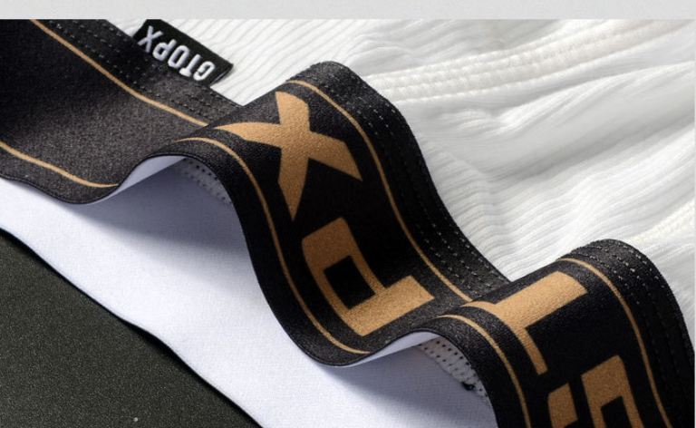 Black and gold sports equipment with 'TopX' branding on a white background