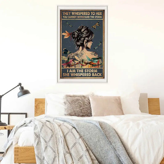 Framed canvas wall art featuring a dragonfly-themed quote print displayed above a cozy, modern bed in a bright bedroom setting.