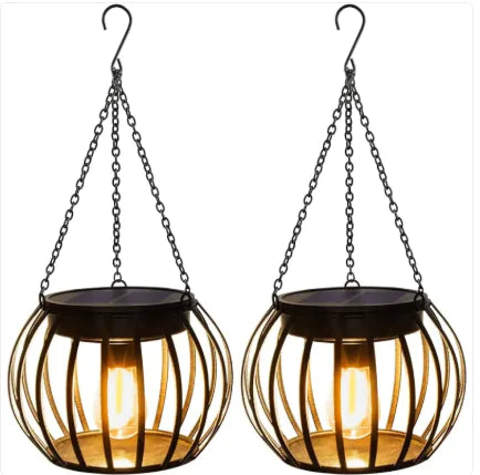 Two hanging solar lights with wire baskets on a white background