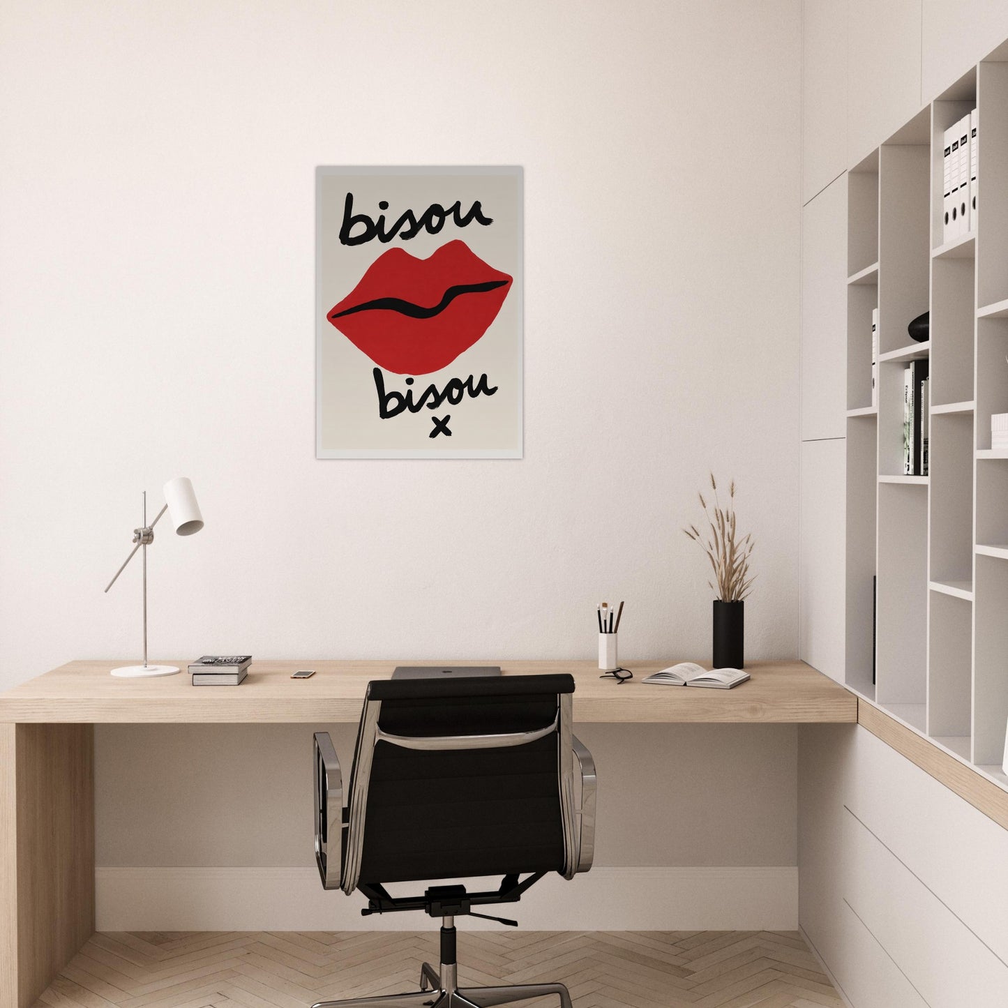 Modern office space with a desk, chair, and wall art featuring lips and text.