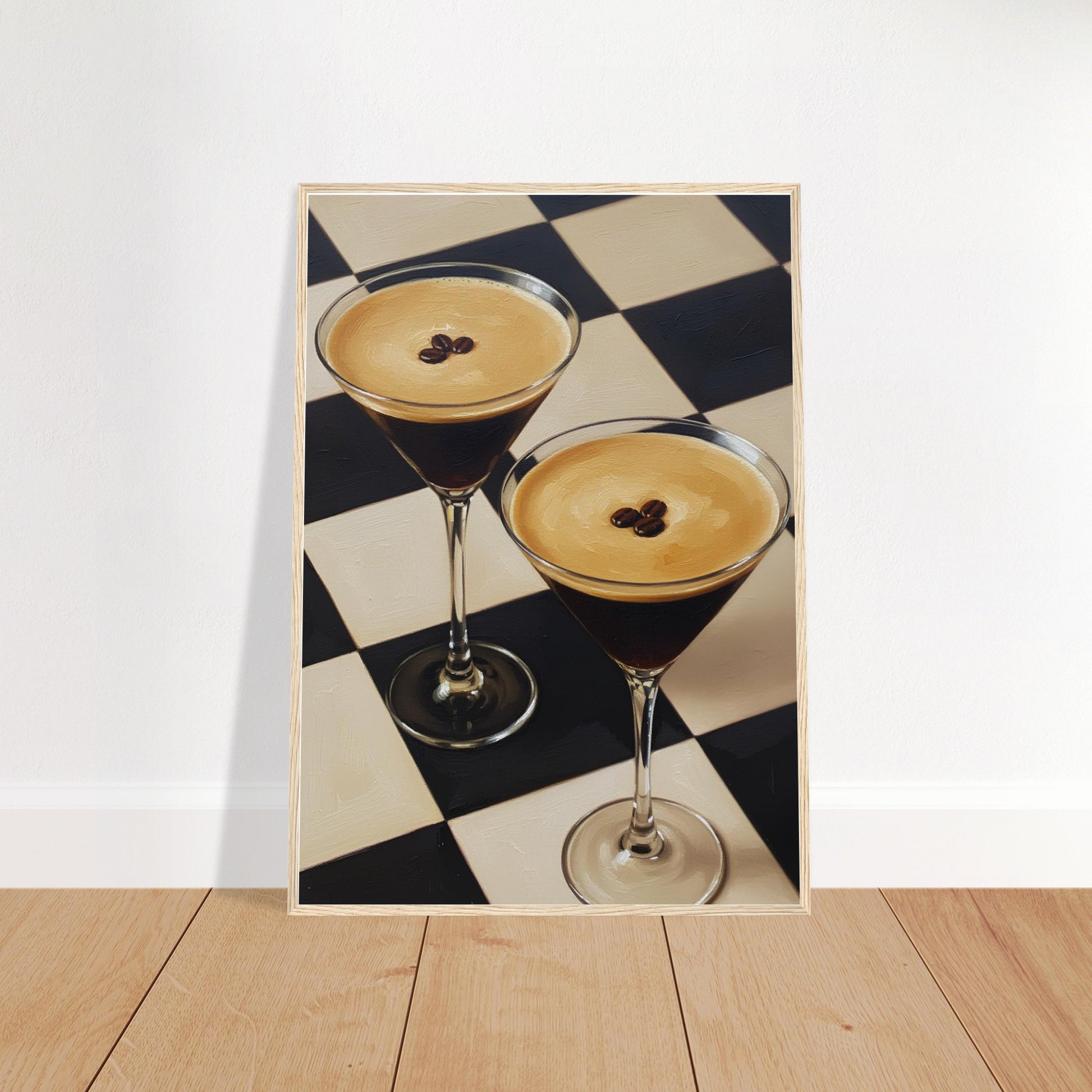 Espresso Martini framed wall art featuring two cocktails on a bold checkerboard background displayed on a wooden floor against a plain wall