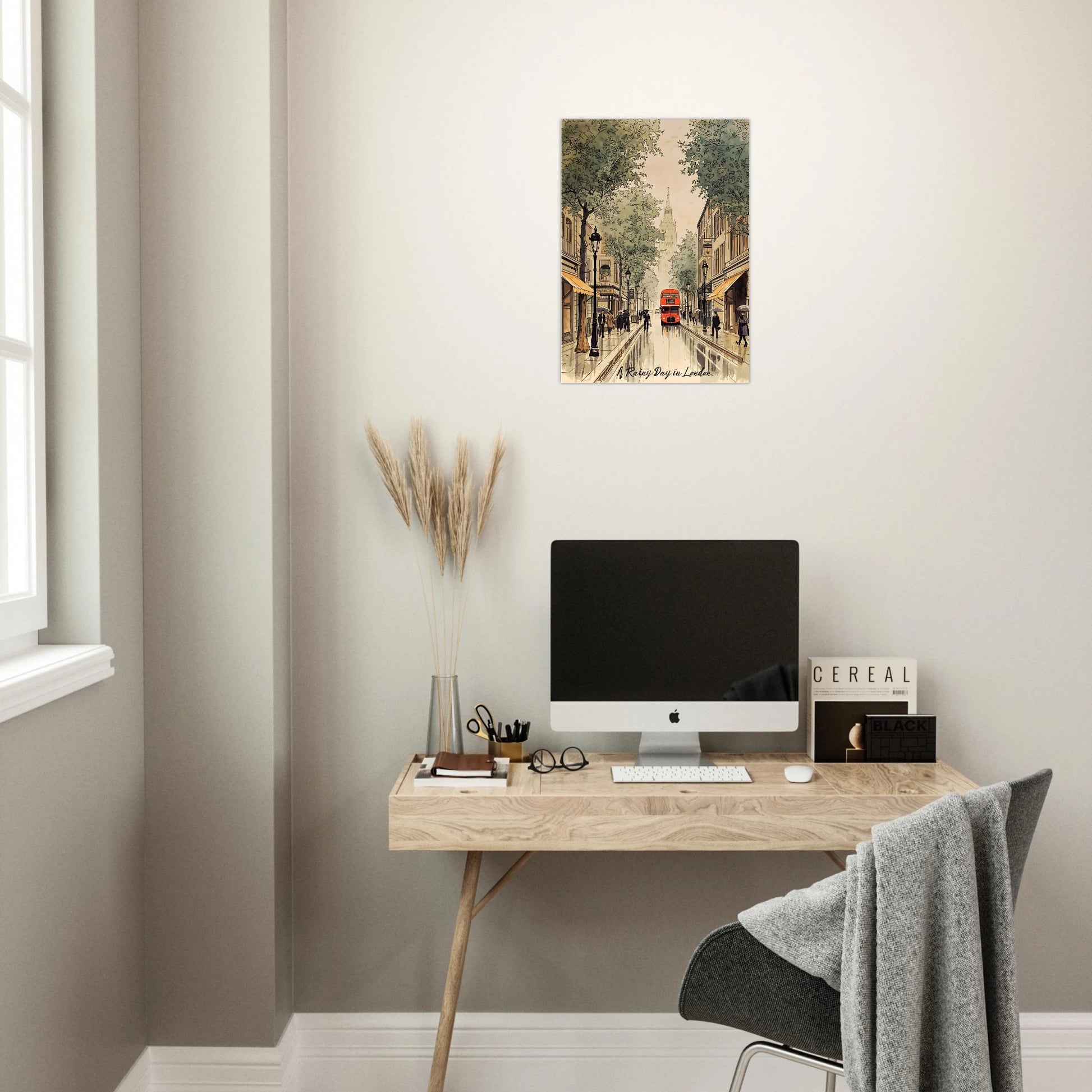 Modern home office with a desk, computer monitor, and wall art.