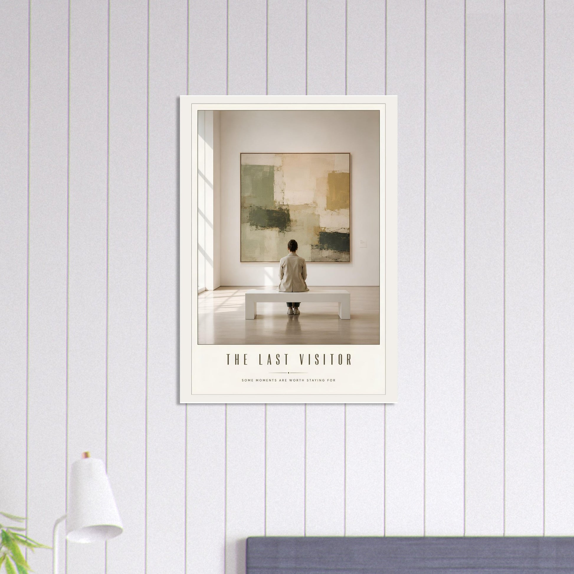 Framed artwork titled 'The Last Visitor' on a wall with a neutral color scheme.