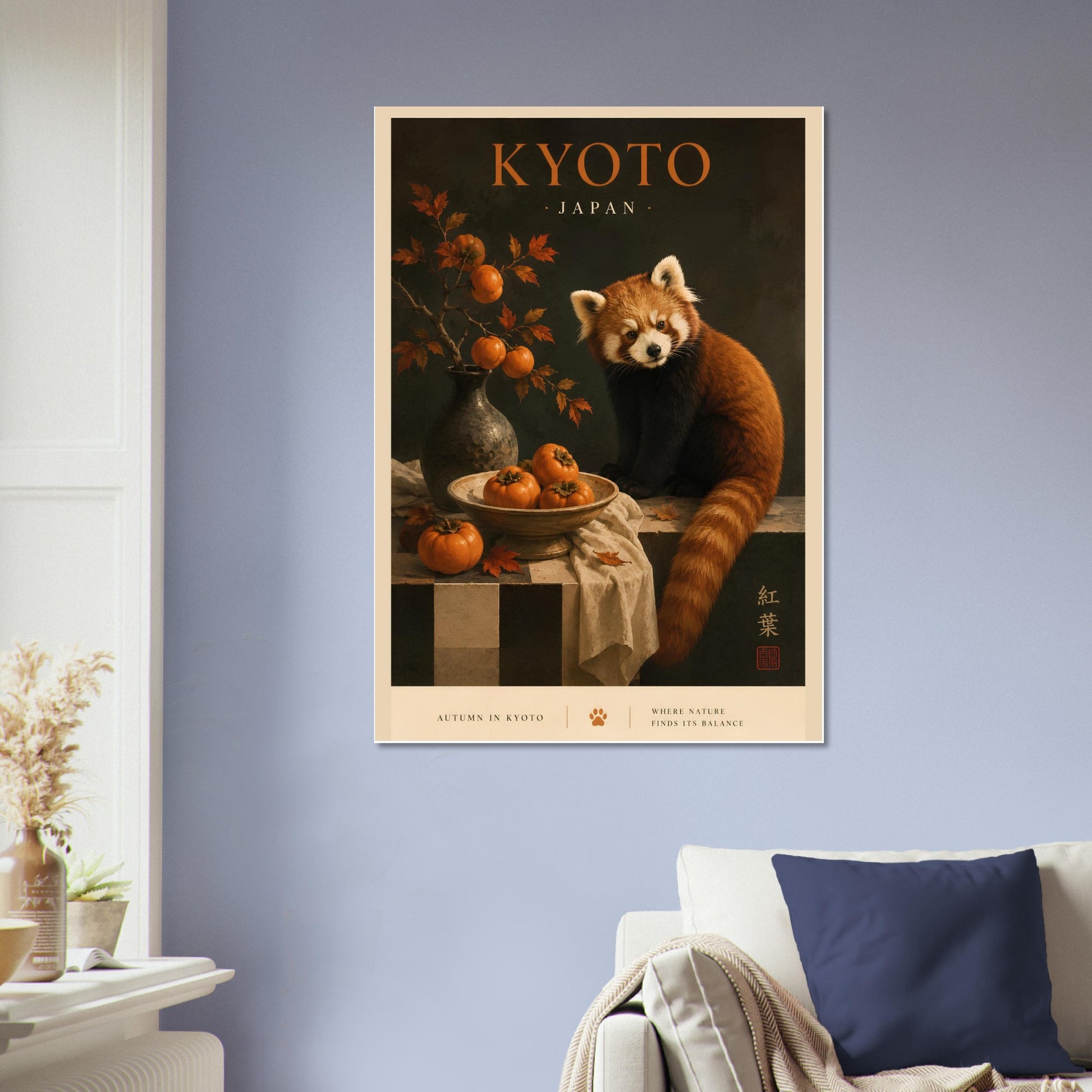 Framed poster of a red panda with 'Kyoto, Japan' text on a wall above a sofa.