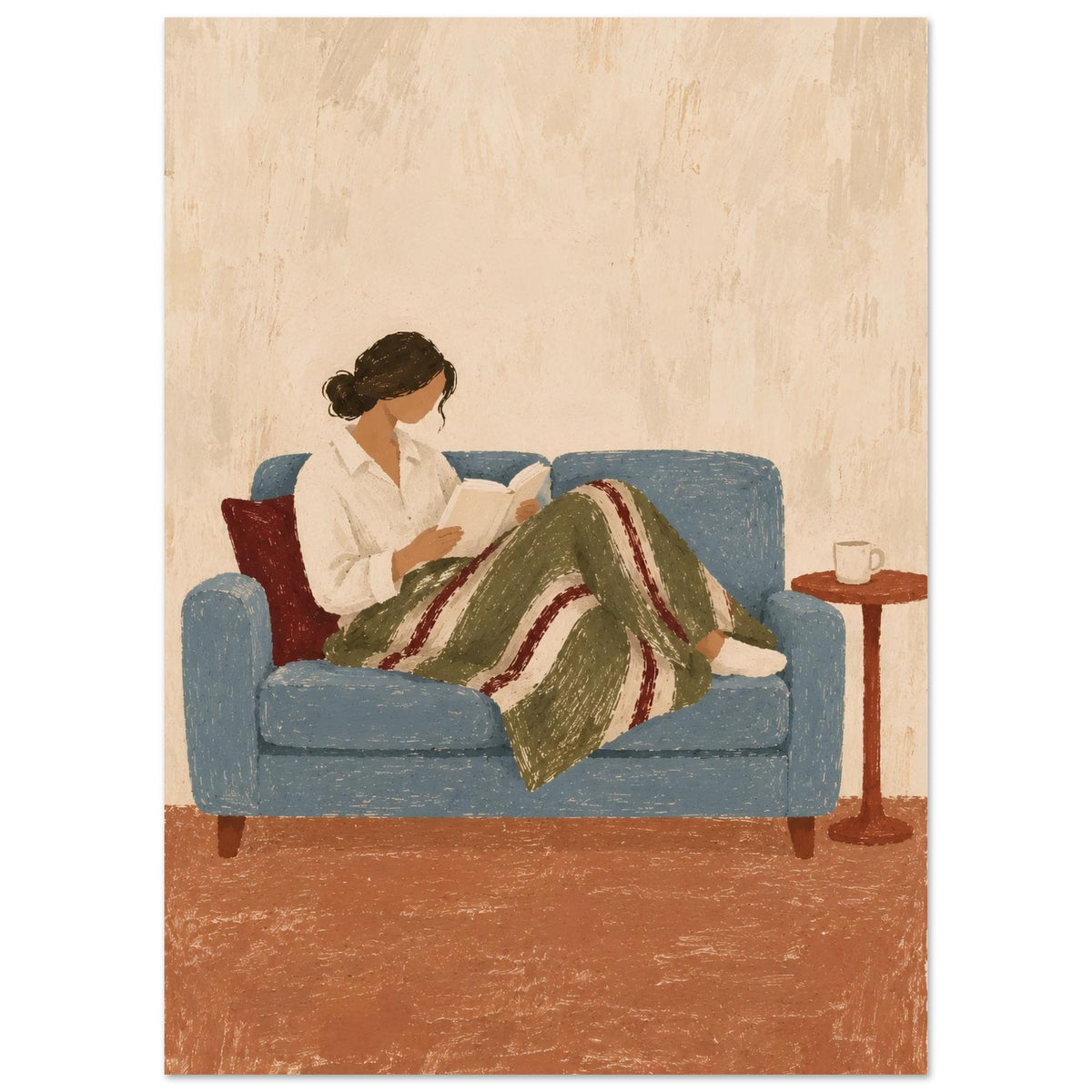 A vertical art print depicting a woman sitting on a blue couch and reading a book, wrapped in a green and red striped blanket, with a small side table holding a mug nearby.