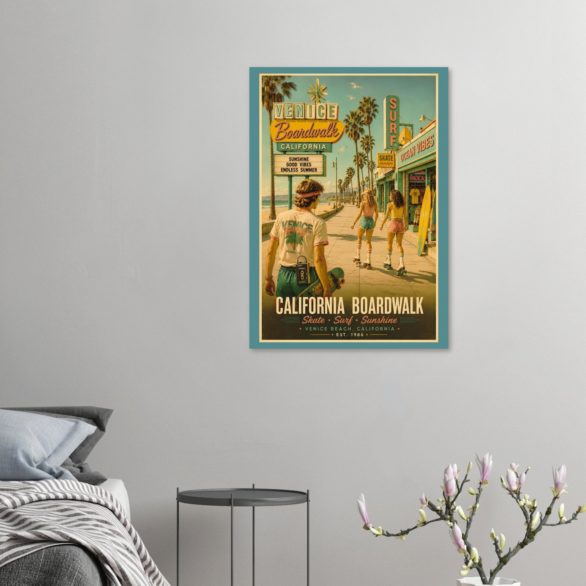 Framed poster of a retro beach scene with people on a gray wall above a bed.