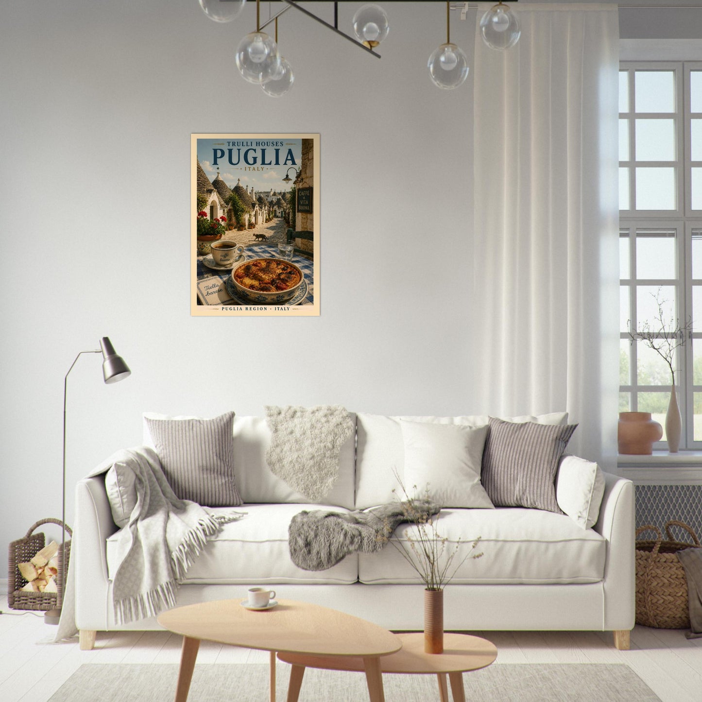 Italian travel poster featuring Puglia displayed above a sofa in a stylish neutral living room