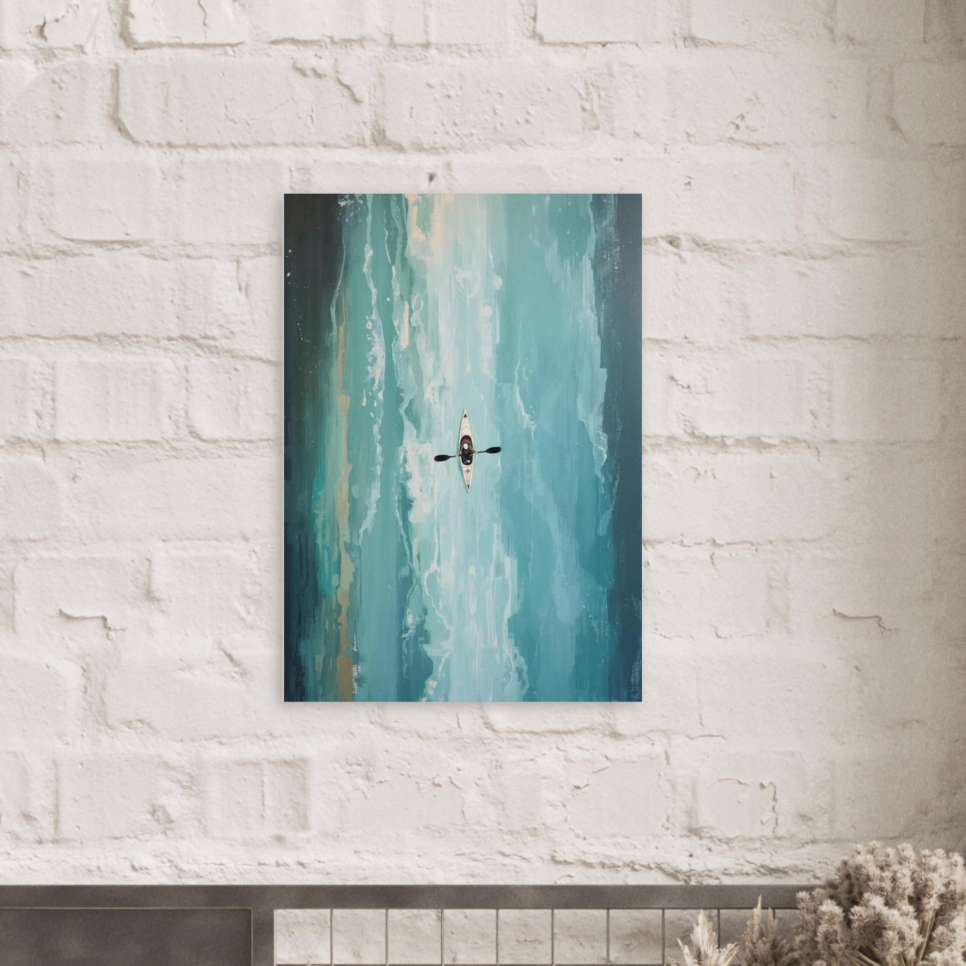 Canvas print of a kayaker in the water hanging on a white brick wall.