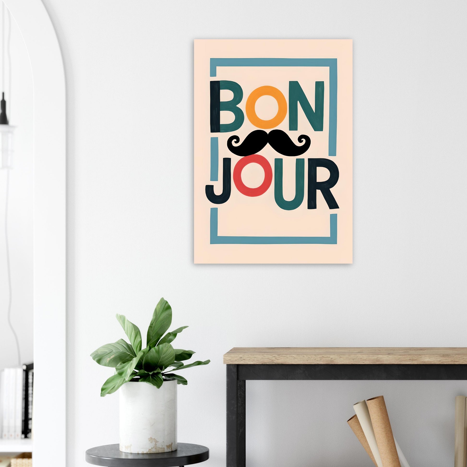 Framed artwork with 'Bonjour' text and mustache on a wall above a desk.