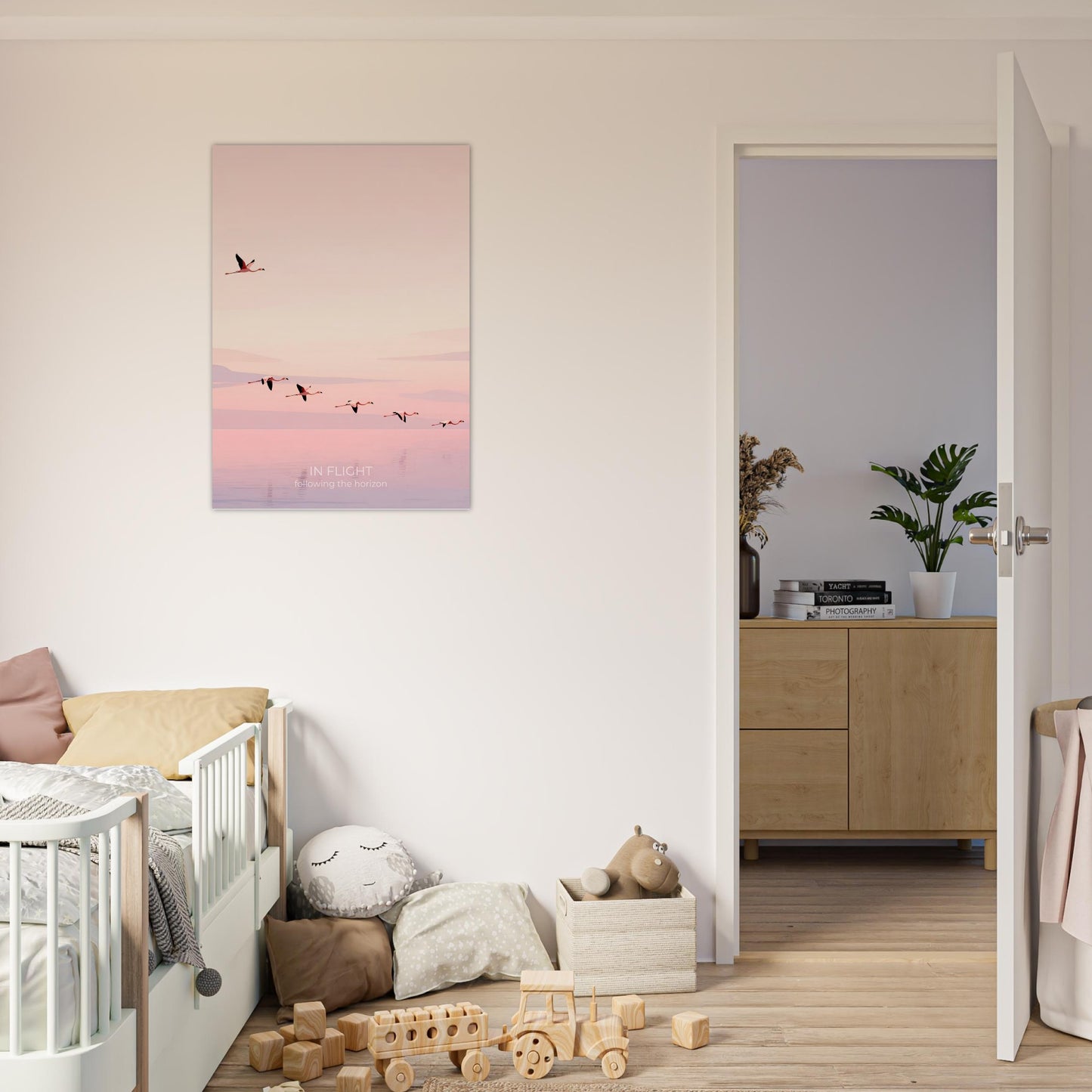 In Flight flamingo poster featured in a stylish nursery, showcasing minimalist bird artwork in calming blush and peach colours