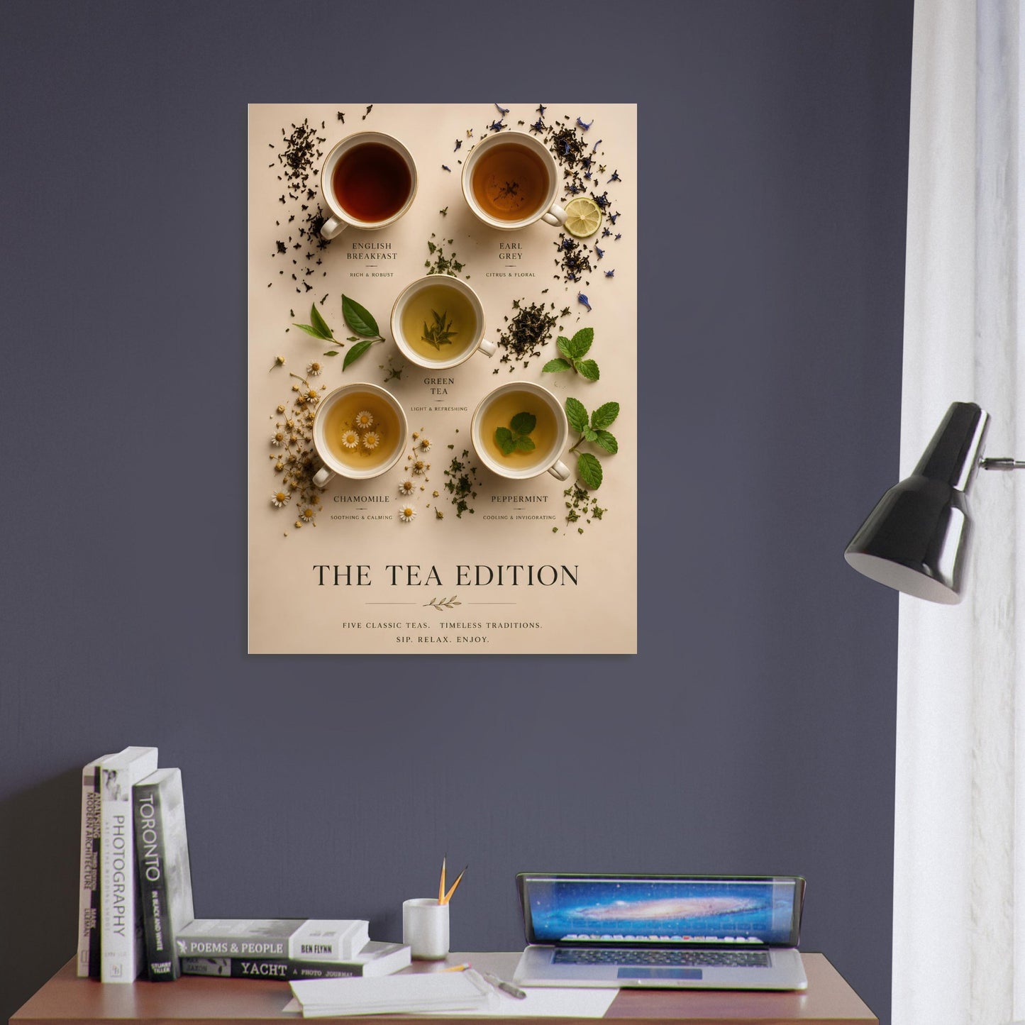 Poster titled 'The Tea Edition' on a wall above a desk with books and a laptop.