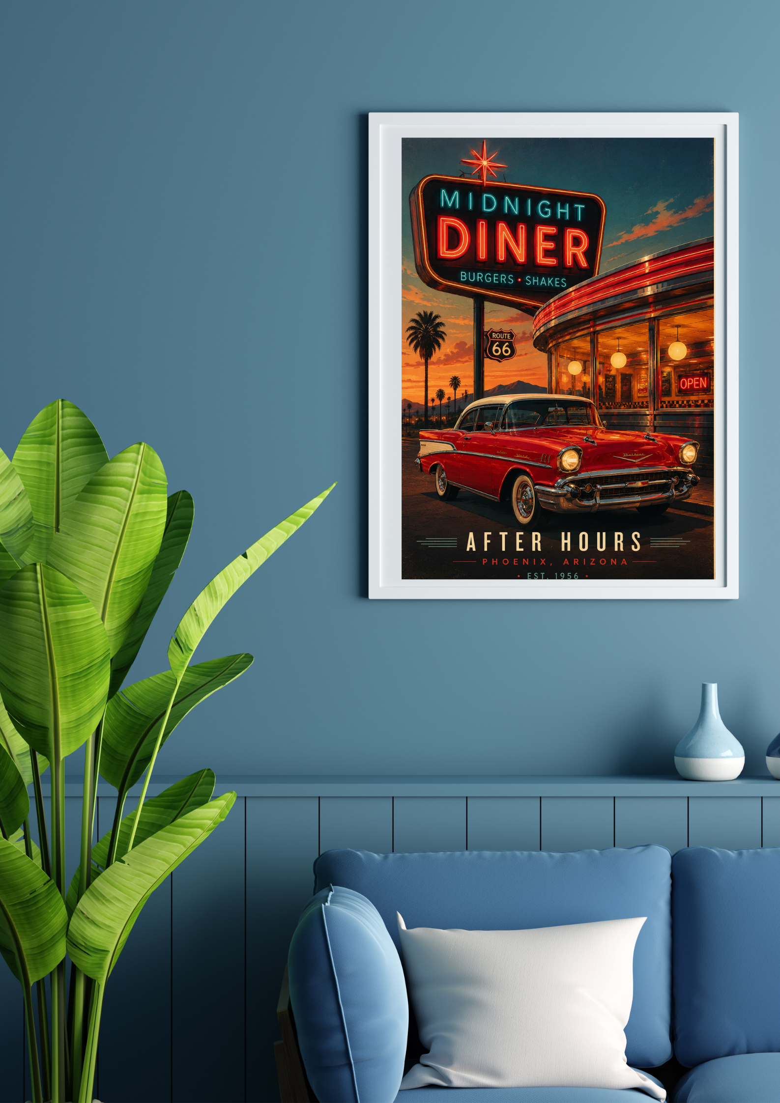 Framed poster of a diner with a red car on a blue wall above a blue sofa.