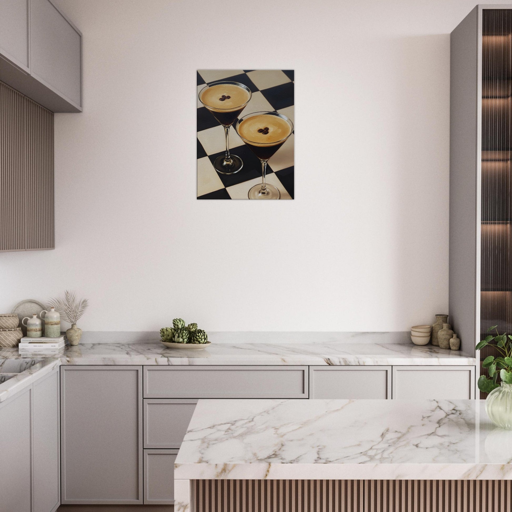 A canvas wall art depicting two cocktails on a black-and-white checkered surface, displayed above a marble countertop in a modern kitchen setting.