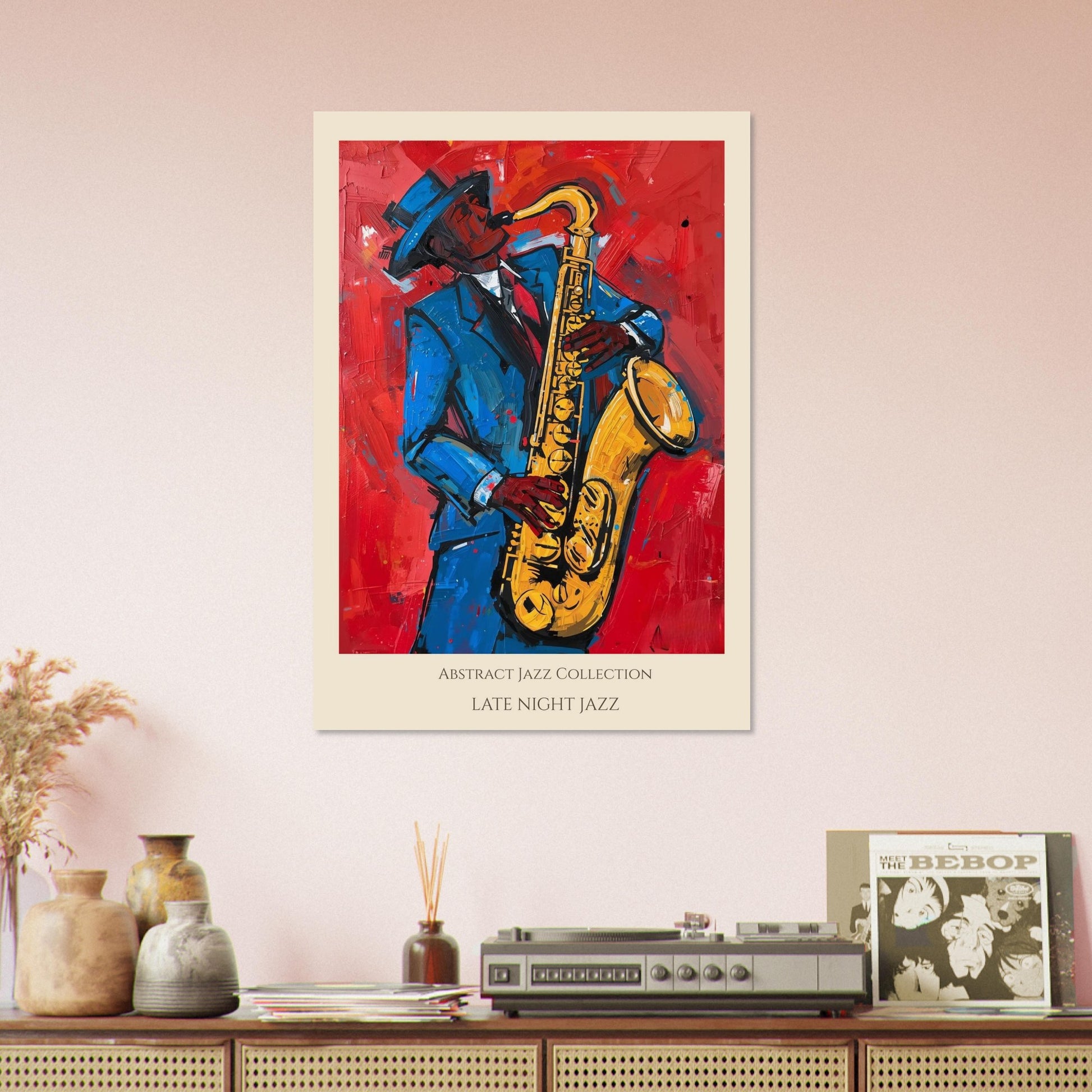 Framed abstract jazz poster of a saxophonist on a wall above a console with vinyl records.