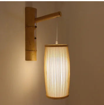 Bamboo wall lamp with a textured shade on a plain wall