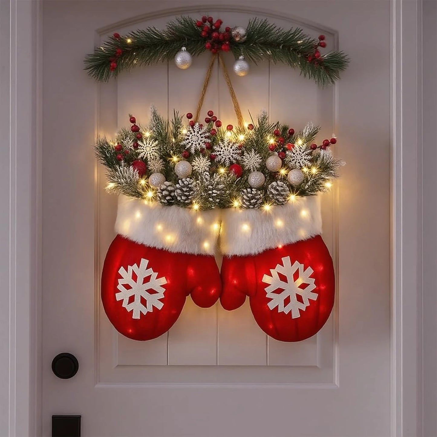 Christmas gloves LED wreath with red mittens, faux pine, and warm lights hanging on door