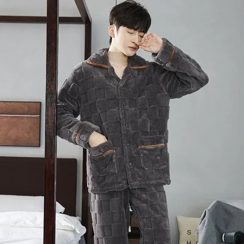 Person wearing a gray quilted pajama set in a bedroom setting.