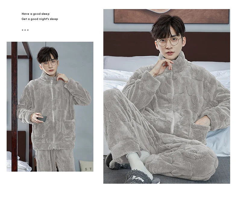 Person wearing a gray fleece onesie in a bedroom setting.