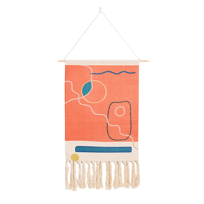 Decorative wall hanging with abstract patterns and fringes on a white background