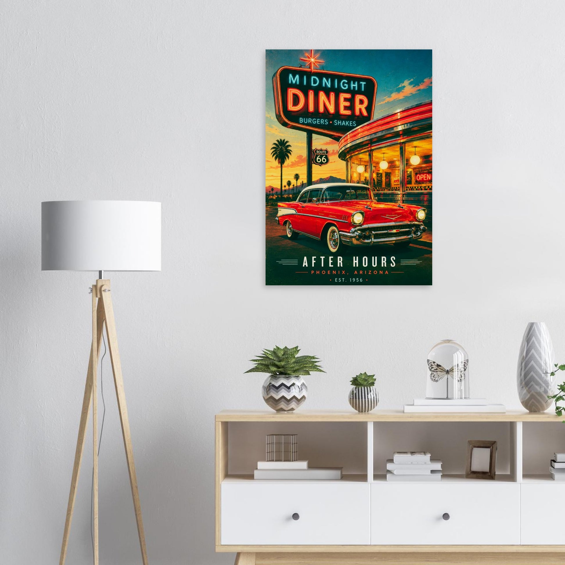Poster of a diner with a red car on a wall above a white shelf with decorative items.