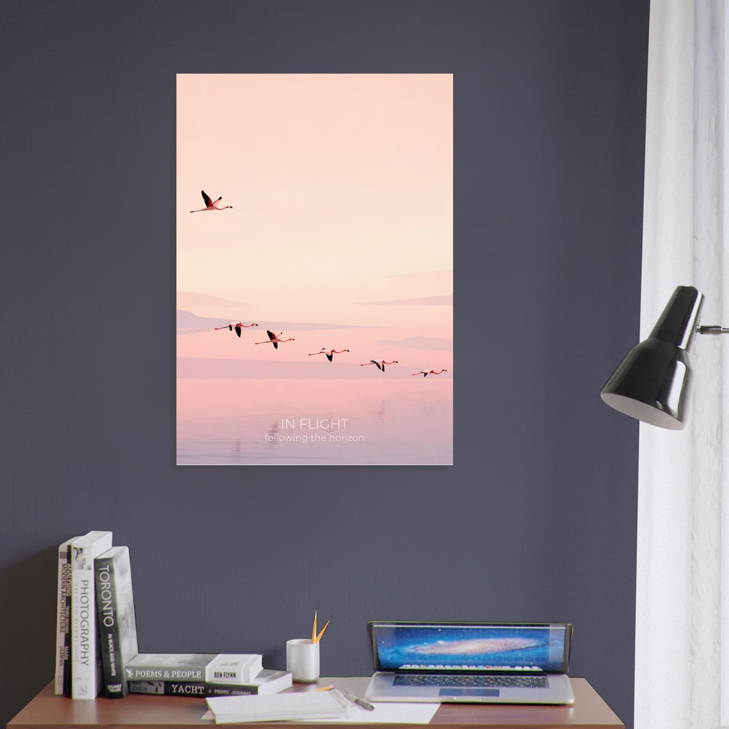 Pink flamingo wall art displayed against a dark blue wall, creating a striking contrast with the soft blush and peach tones.