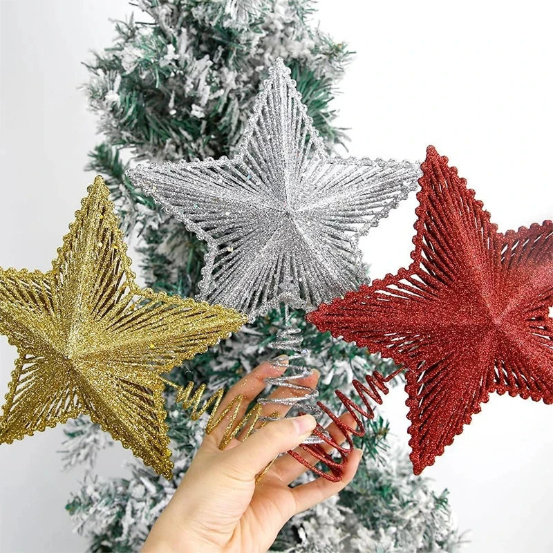 Decorative star ornaments in gold, silver, and red on a Christmas tree.