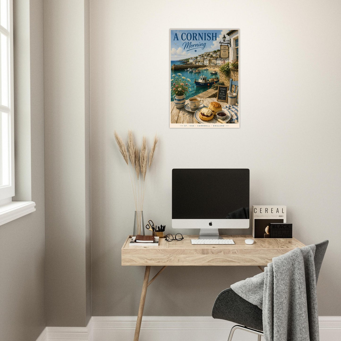 Modern home office with a desk, computer, and decorative poster on the wall.