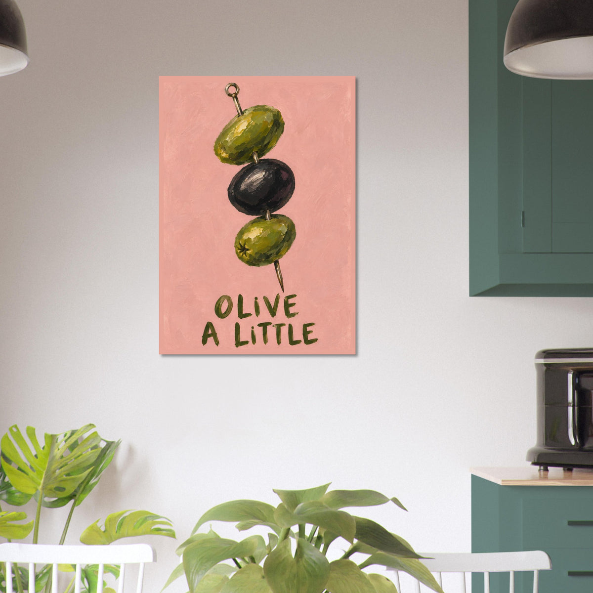Olive a Little print in a bright kitchen with green cabinetry, leafy plants and a white pendant light.