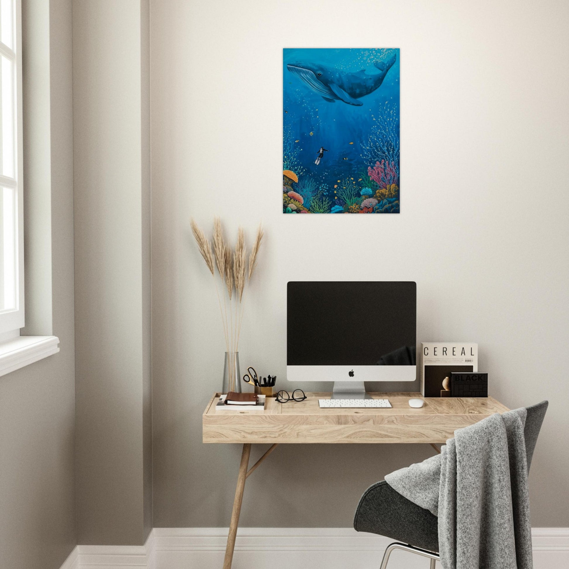 Modern home office with a desk, computer monitor, and decorative elements.