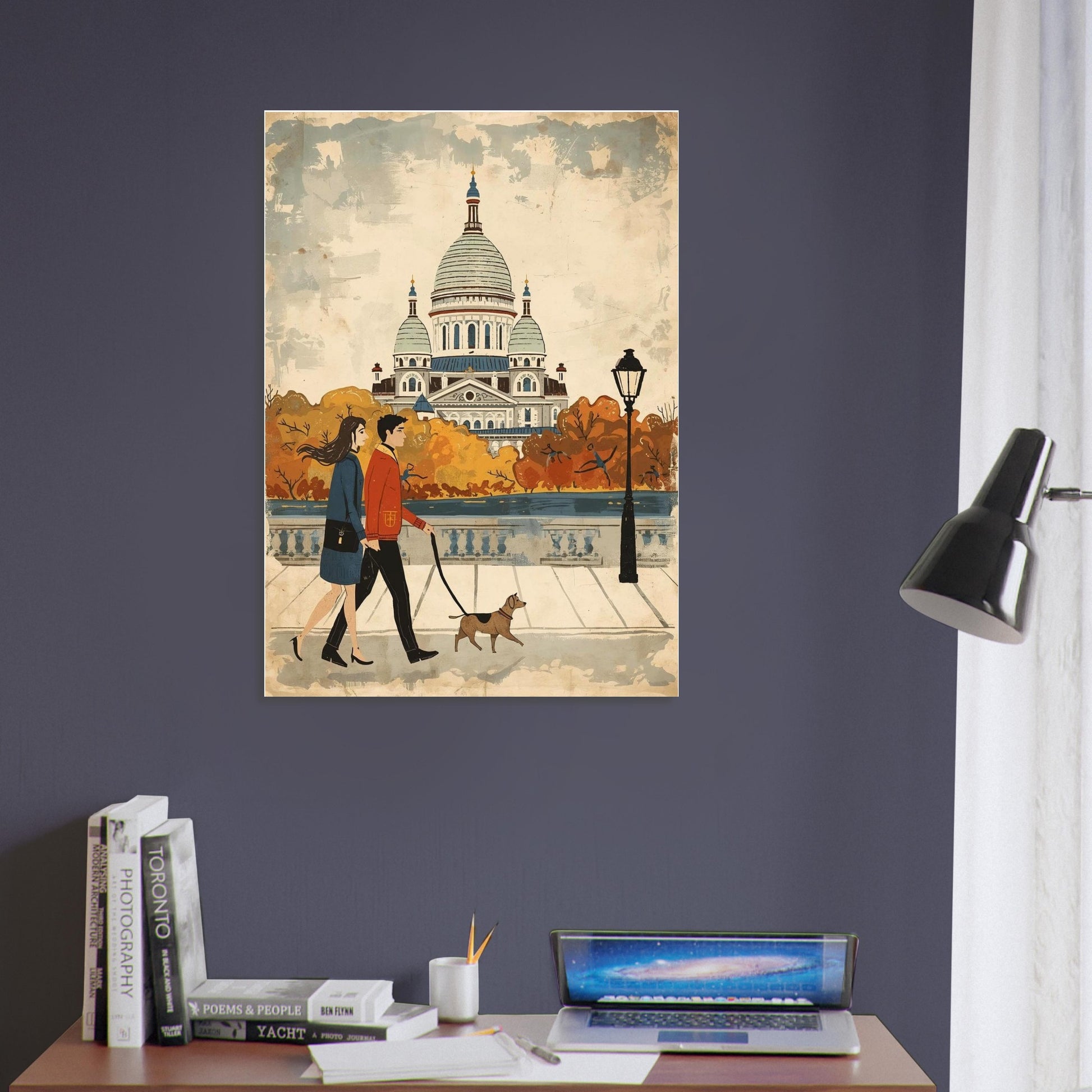 Poster of a couple walking a dog with a cathedral in the background on a purple wall above a desk.