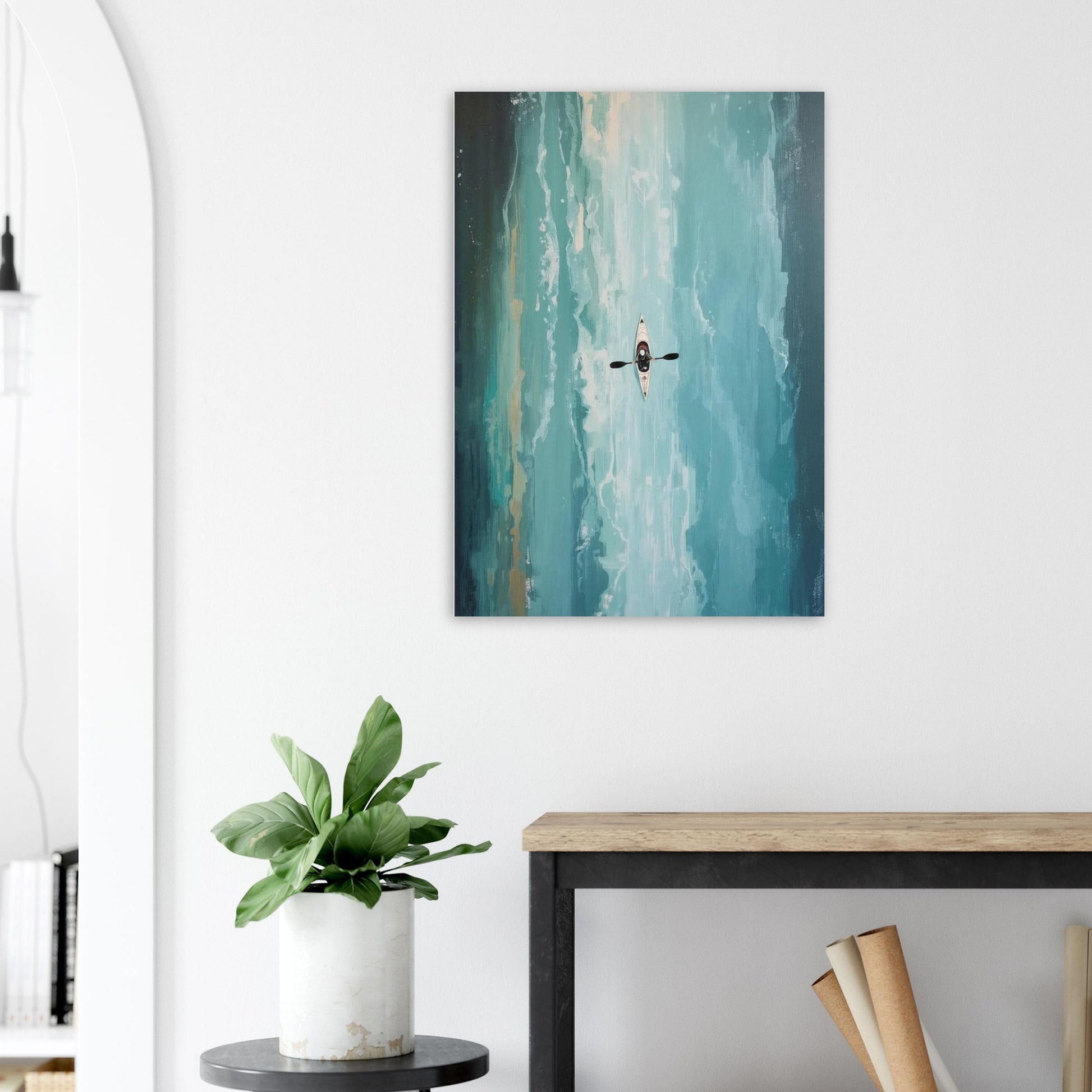 Abstract painting on a wall of a Turquoise ocean kayak above a desk with a plant and books.