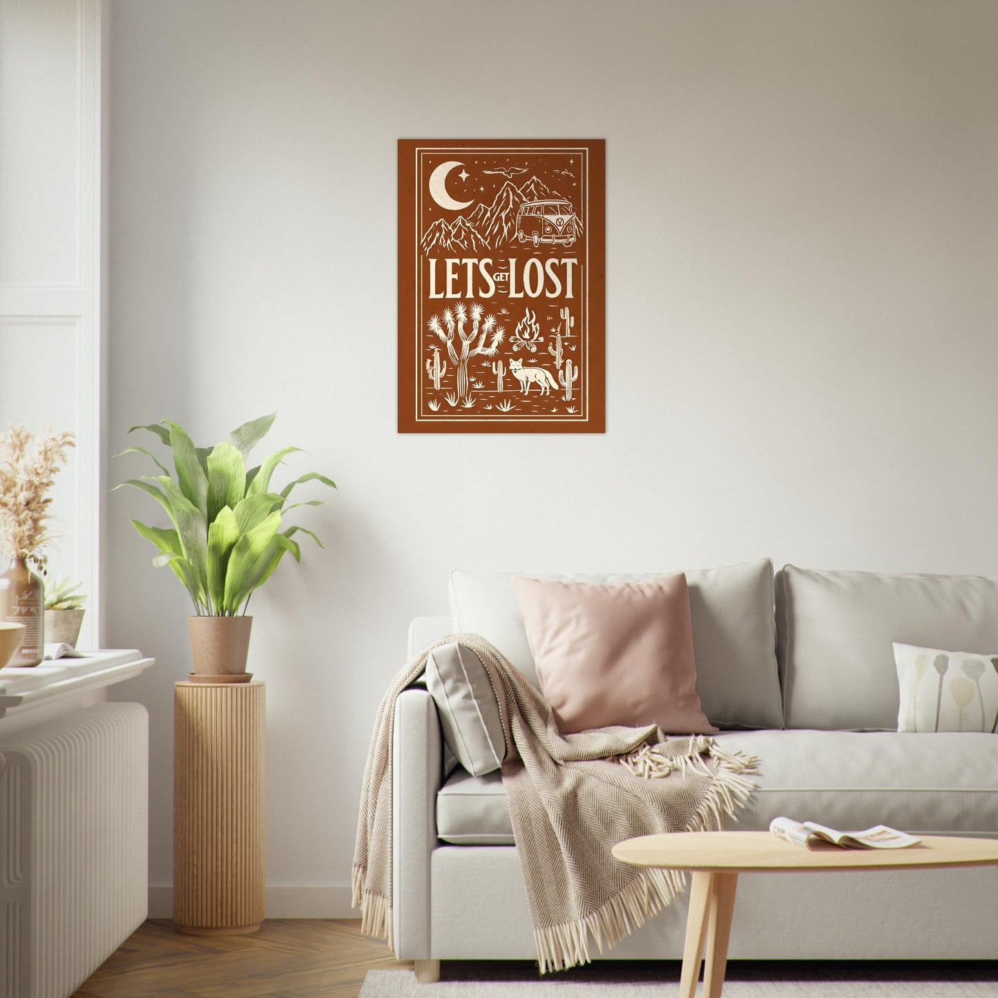 Decorative wall art with 'Let's Get Lost' text in a living room setting.
